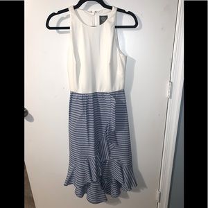 High neck, sleeveless dress.